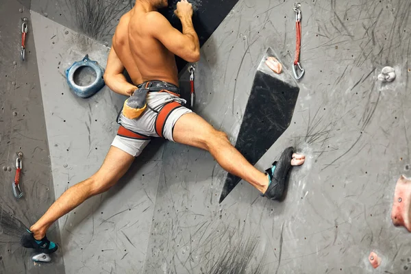 Panoramic man bouldering at an indoor climbing centre. — Stock Photo, Image