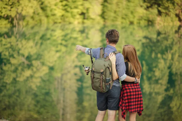 Young amorous man is standing with his girlfriend — Stock Photo, Image