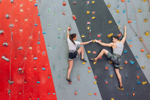 Friends spending their time at climbing wall