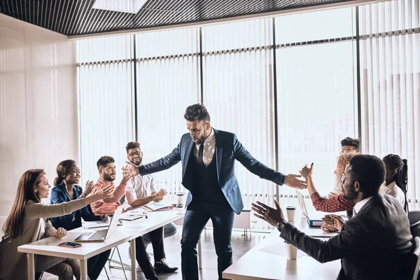 Excited bearded mman giving high five to his colleagues — Stock Photo, Image