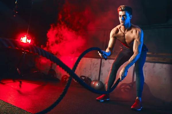 Man practices Battle Rope Exercise, great for improvement of Athletic Training