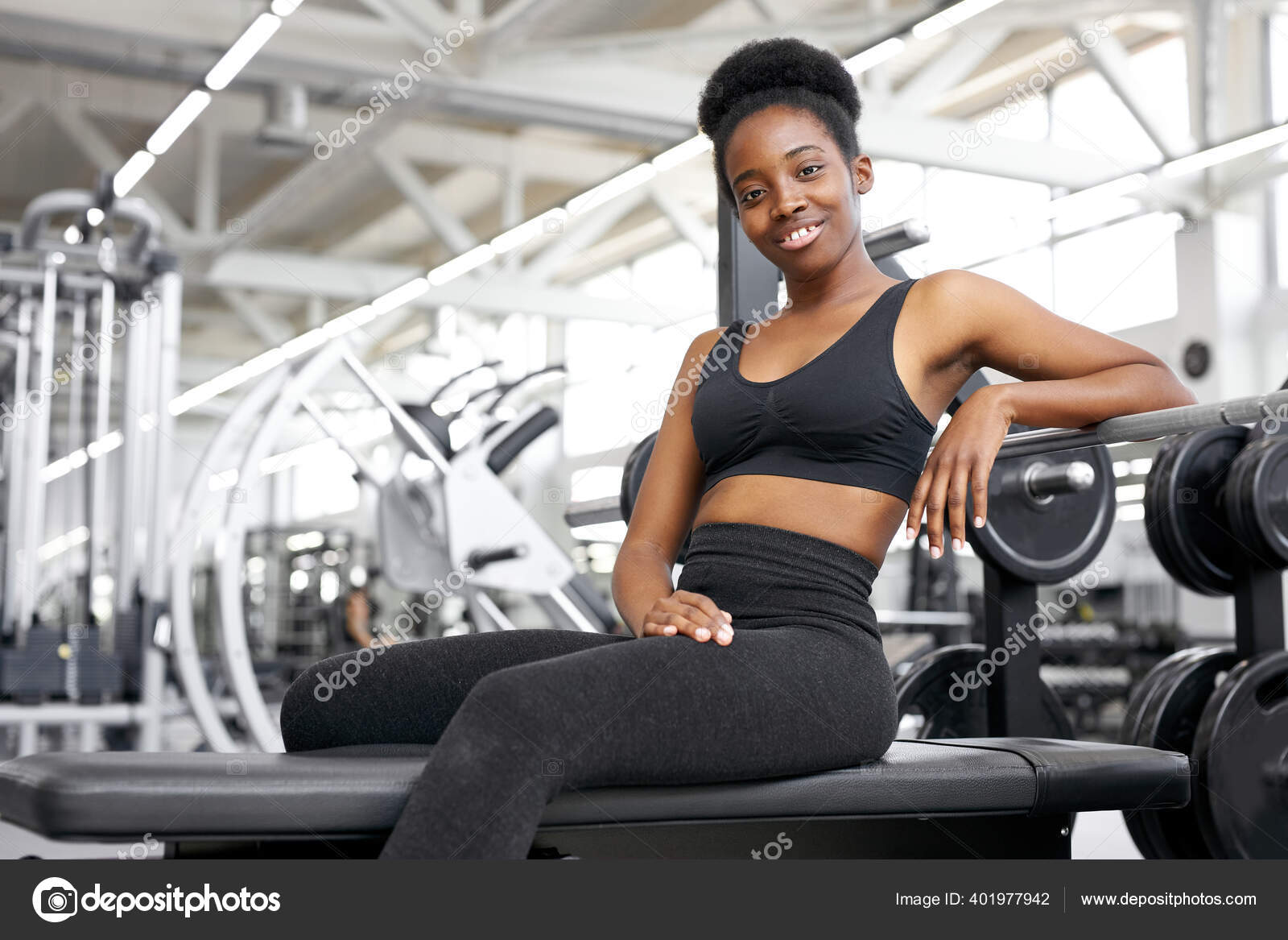 Portrait of black woman taking a break after workout at gym Stock Photo by  ©ufabizphoto 401977942