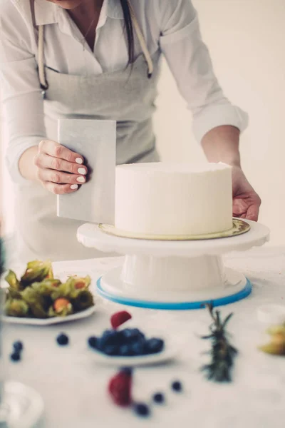 girl working with pastry cutter in the kitchen