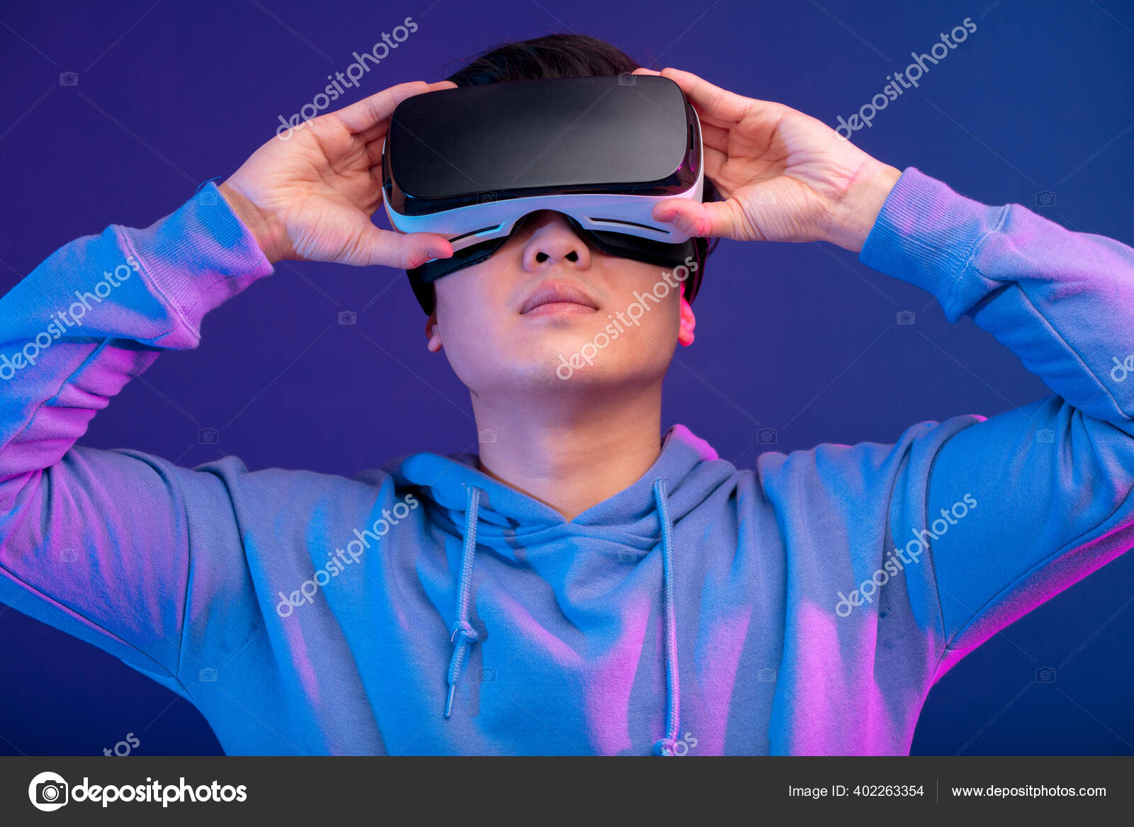 Chinese man using the virtual reality headset gesturing with hands isolated  — Stock Photo © ufabizphoto #402263354