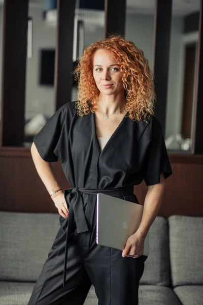 Female blogger with frizzy red hair glad to participate in intresting meeting