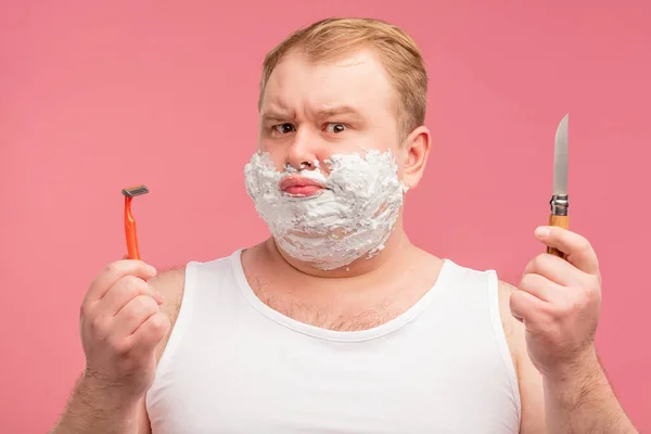 Morning man with foam on cheeks, has sad displeased expression, tired of shaving — Stock Photo, Image