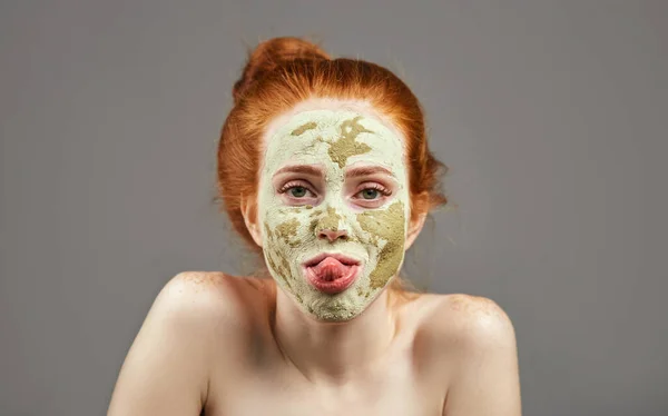 Funny ginger girl showing her tongue — Stock Photo, Image