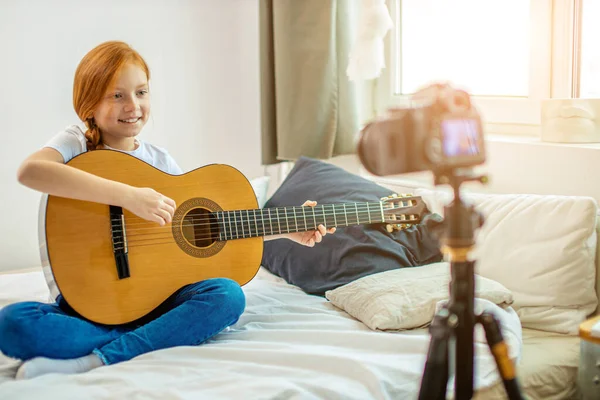 young blogger perform music at camera