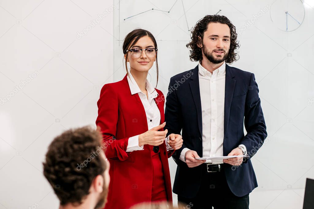 two business people hold conference
