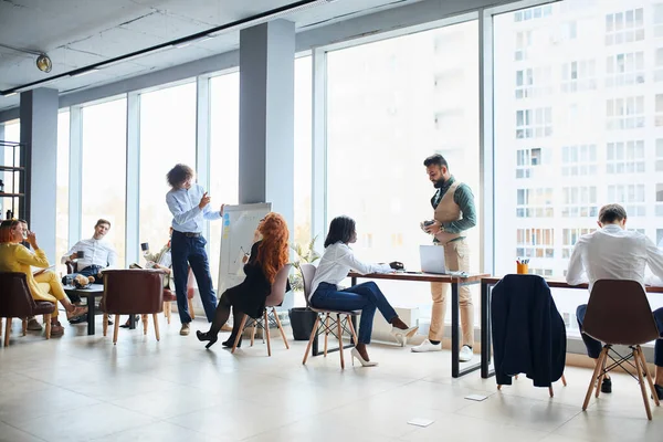 Young caucasian businessman make presentation to leaders, co-workers — Stock Photo, Image