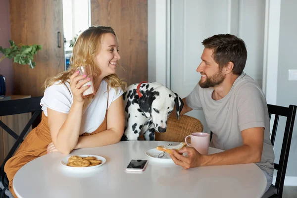 Awesome woman and man have happy pastime at home, have meal — Stock Photo, Image