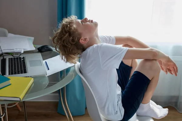 Sleepy teenager boy sit alone at home — Stock Photo, Image