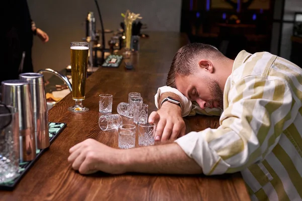Very drunk man sleep in the bar — Stock Photo, Image