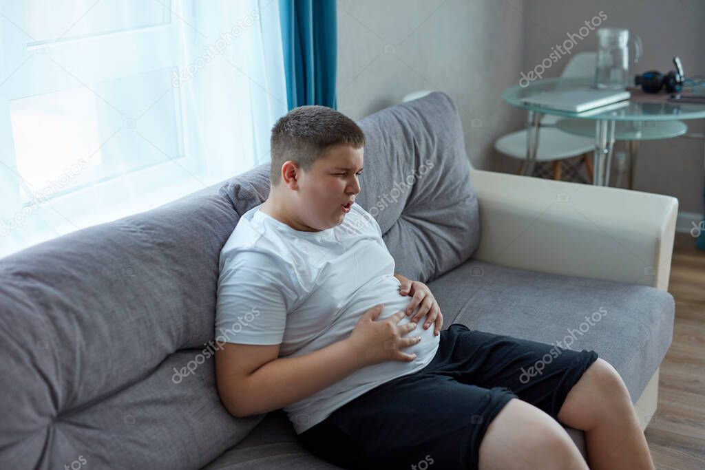 child boy has bloating after a fatty meal