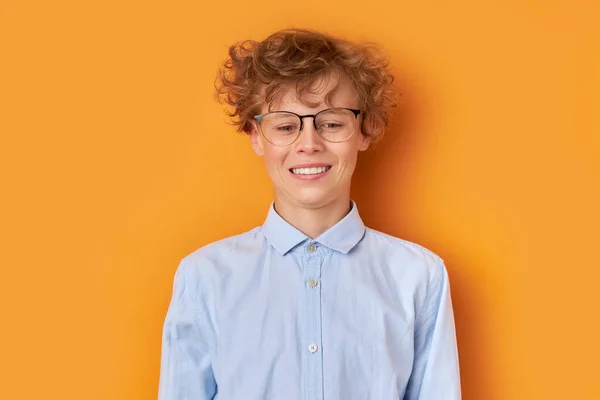 open-minded good school boy in eye glasses