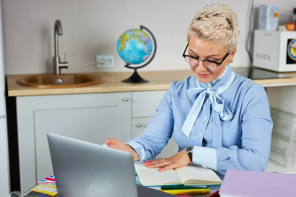 caucasian female young school teacher using webcam at home