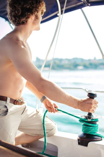 Captain sail boat working on the boat with Winch on a sailboat. — Stock Photo, Image
