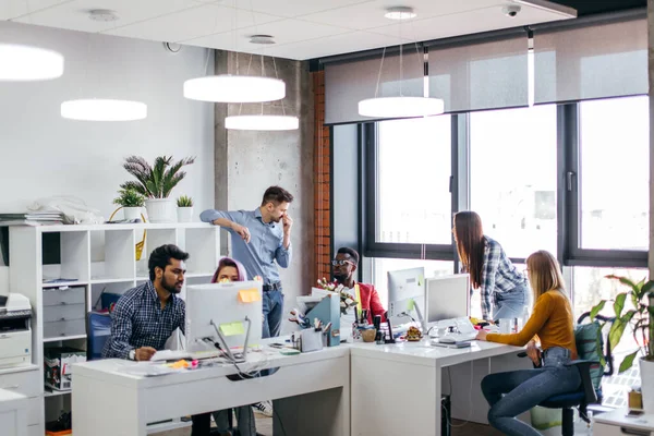 Young people group in modern office have discussion of a new project — Stock Photo, Image