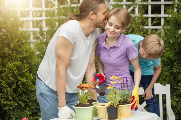 Happy family gardening together and taking care of nature — Stock Photo, Image