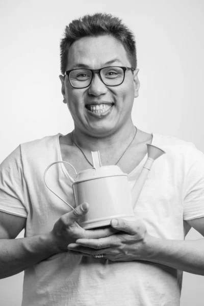 Happy funny Asian man in his 30s in white usual t-shirt with different positive emotions — Stock Photo, Image