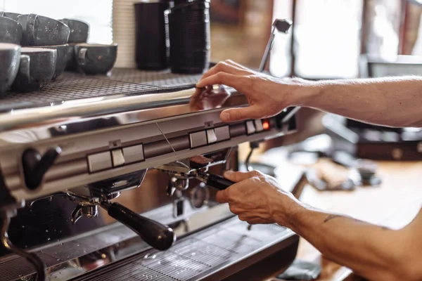 Male is turning the coffee machine off — Stock Photo, Image