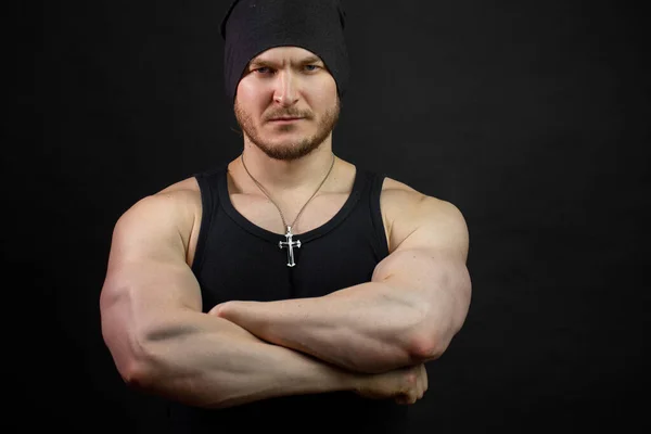 Big serious strong man in black clothes — Stock Photo, Image