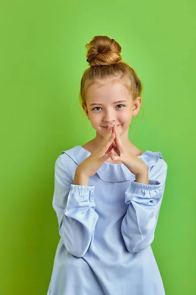 Intelligent caucasian kid girl is thinking about something — Stock Photo, Image