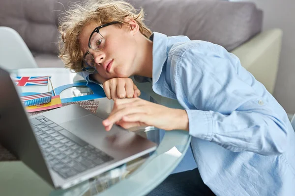 Indignant tired boy does not understand how to do homework — Stock Photo, Image