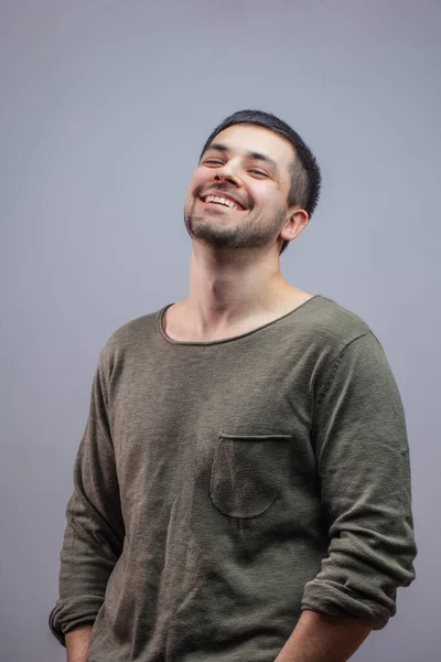 Portrait of sporty young man laughing at joke — Stok Foto