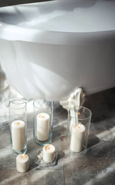 candles for romantic date in bathroom with modern interior