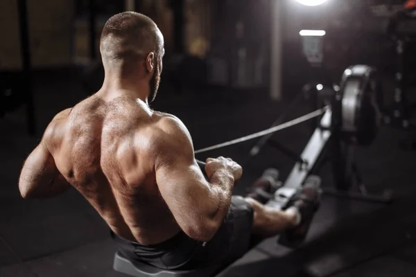 Focus on a beautiful nude back of strong sportsman — Stock Photo, Image