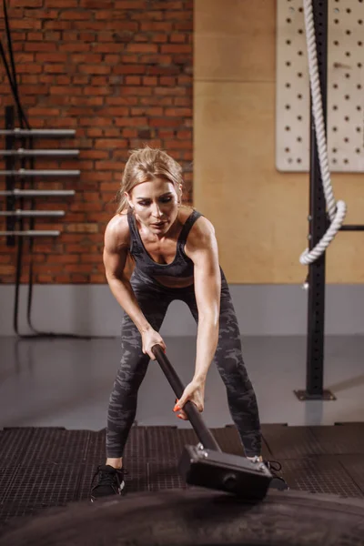 Fitness woman workout on TRX straps in gym. Crossfit style. Training TRX.  Stock Photo by ©ufabizphoto 248263970