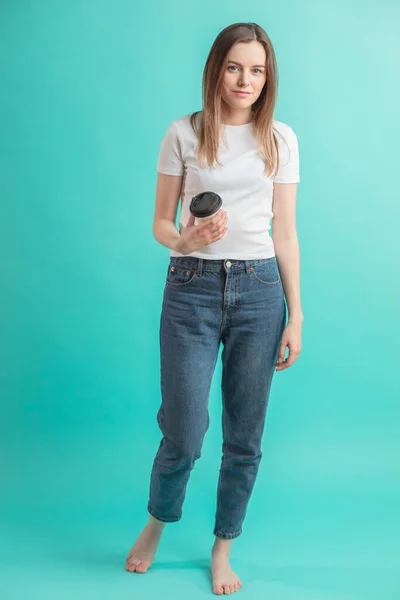 Full length portrait of beautiful female student having coffee, tea isolated — Stock Photo, Image