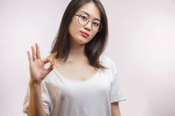 Young Asian attractive woman wearing her new optical glasses , showing OK sign — Stock Photo, Image