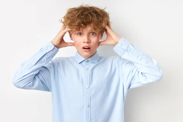 Caucasian boy did something, now he doesnt know what to do — Stock Photo, Image