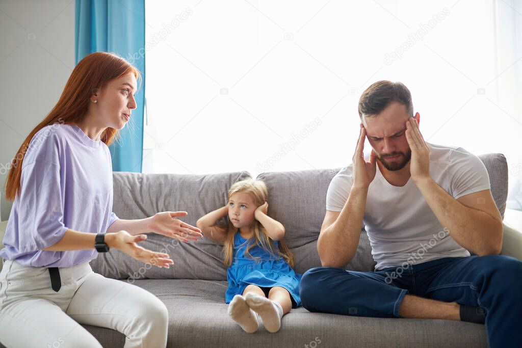 young caucasian parents argue at home