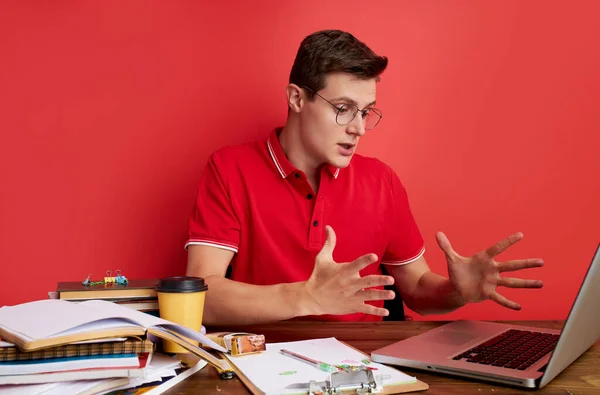 young stressed caucasian male working with computer laptop in frustration, depression.