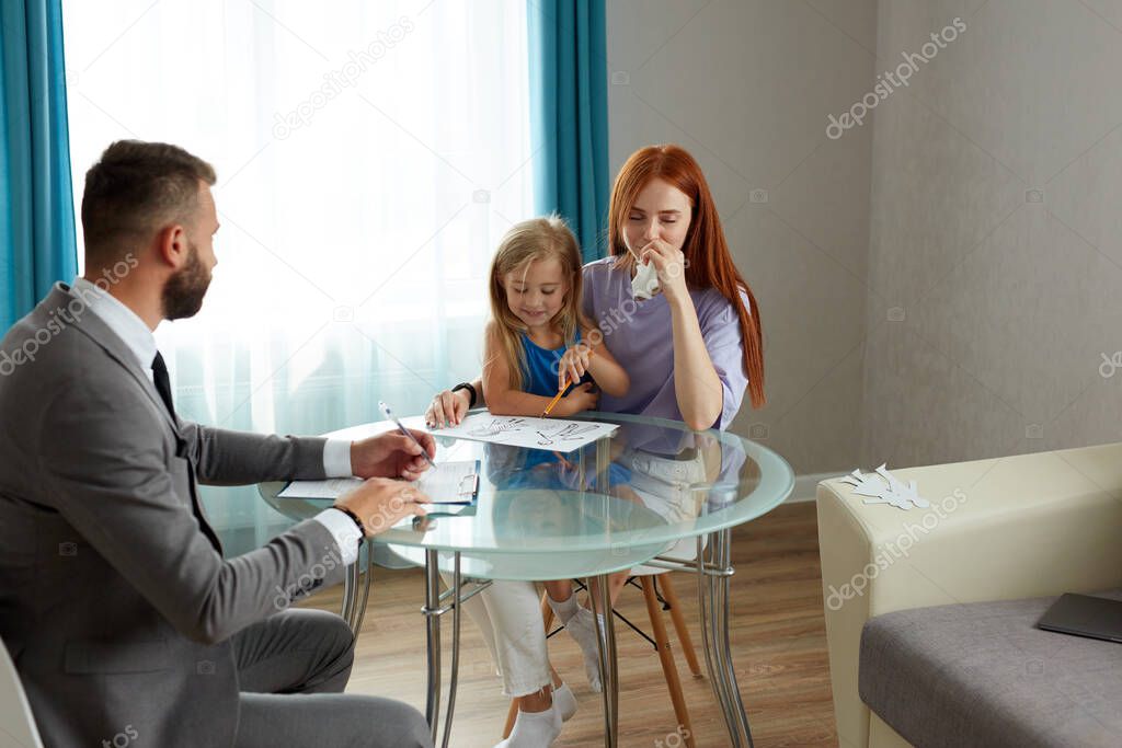 depressed caucasian woman with child girl get support by psychologist