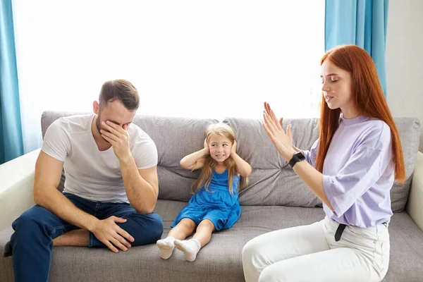 Child girl is suffering from quarrels between parents in the family at home — Stock Photo, Image