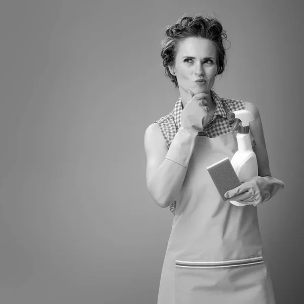 Pensive Modern Woman Rubber Gloves Kitchen Sponge Bottle Detergent — Stock Photo, Image