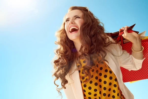 Happy Stylish Woman Light Jacket Shopping Bags Looking Distance Blue — Stock Photo, Image