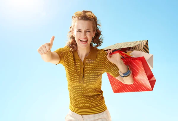 Happy Young Woman Shopping Bags Showing Thumbs Blue Sky — Stock Photo, Image