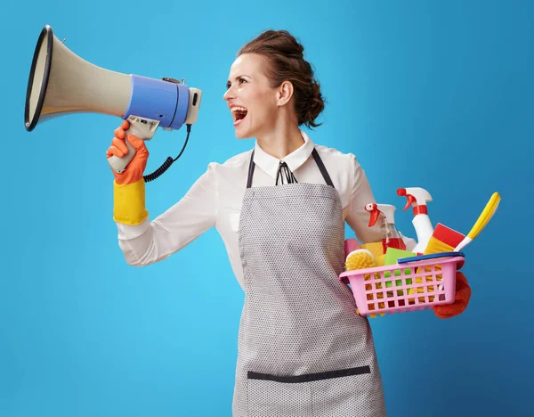 Happy Housemaid Apron Basket Detergents Brushes Shouting Megaphone Isolated Blue — Stock Photo, Image