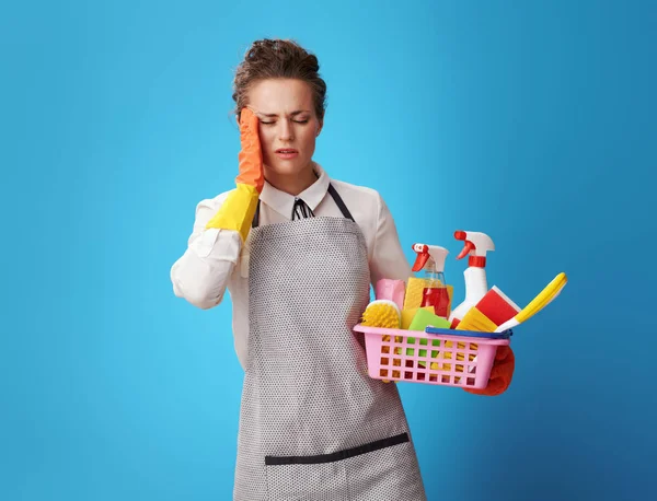 Portrait Stressed Young Cleaning Woman Apron Basket Cleansers Brushes Isolated — Stock Photo, Image