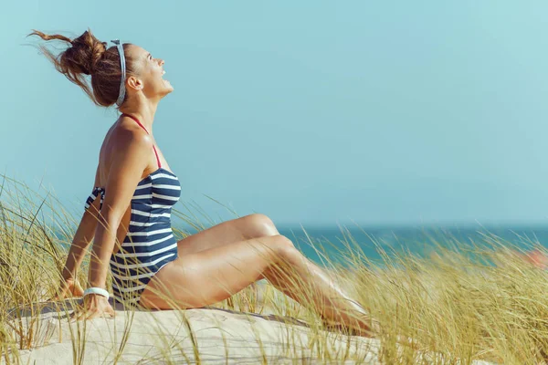 Smiling Modern Woman Striped Beachwear Seashore Relaxing Bun Hairstyle Sunny — Stock Photo, Image