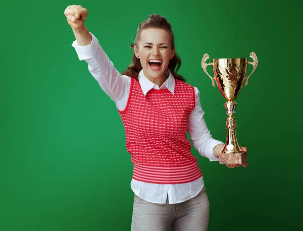 Smiling fit learner woman with golden goblet rejoicing — Stock Photo, Image