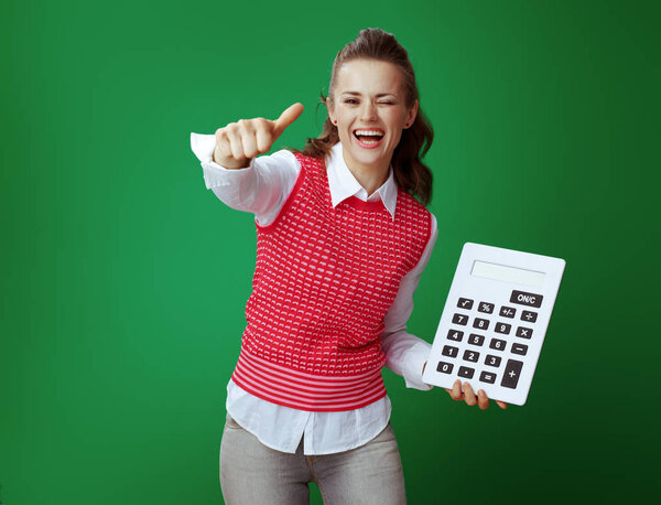 learner woman with big white calculator showing thumbs up