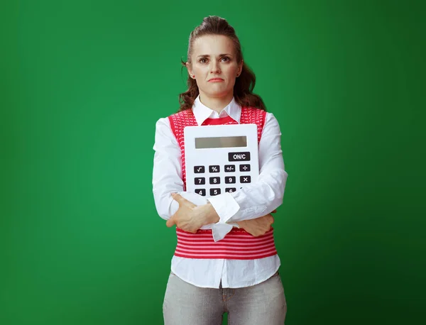 Sad healthy student embracing big white calculator — Stock Photo, Image