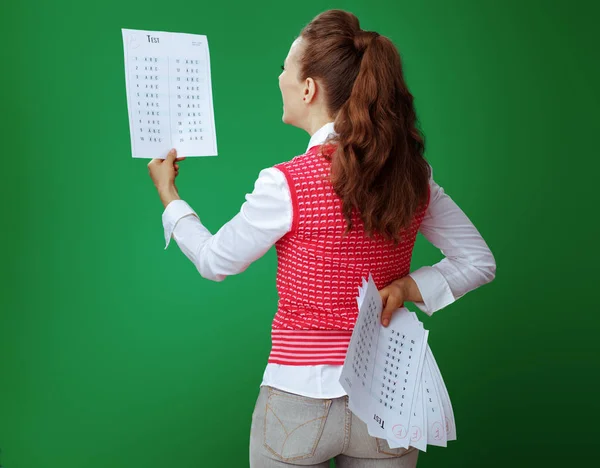 Student showing A+ exam result in one hand and several F test re — Stock Photo, Image