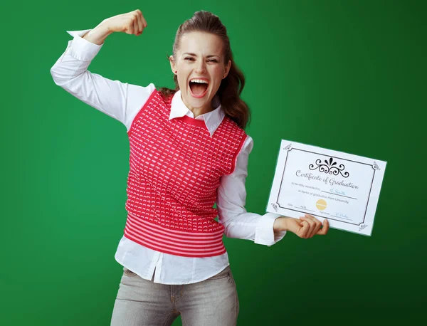 Student woman with Certificate of Graduation showing biceps — Stock Photo, Image